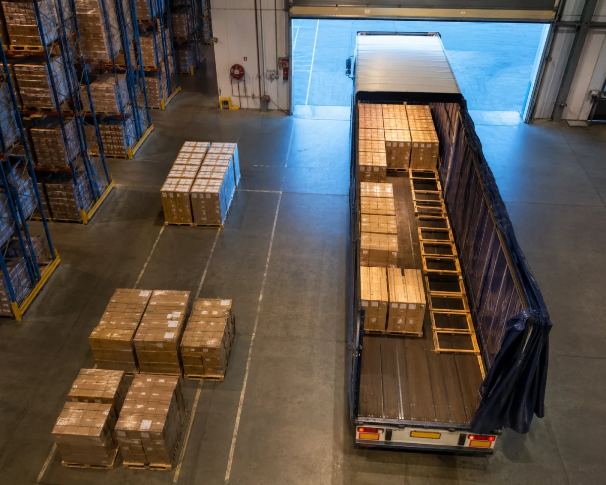 Loading bay seen from above as a trailer is loaded before dawn in Adelaide