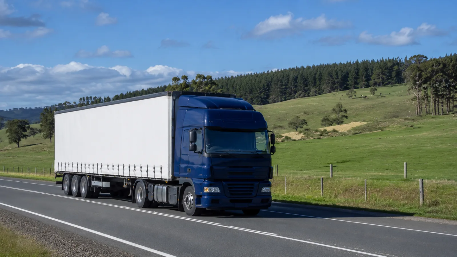 Semi-trailer on the Princes Highway through the green south-east farmland