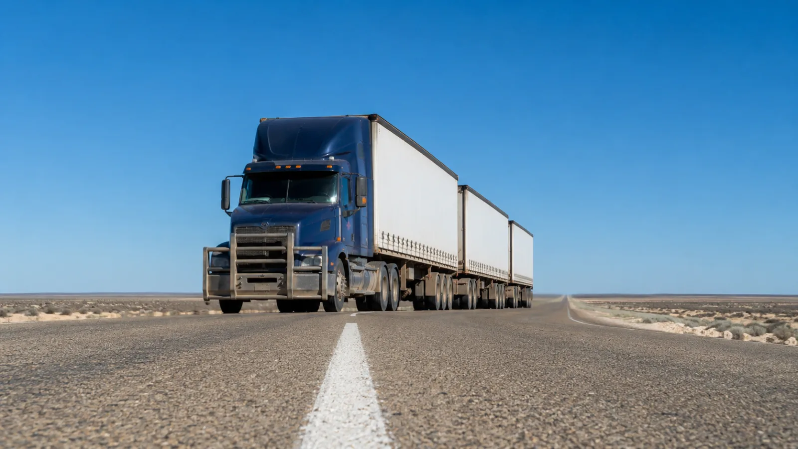 Road train on the 90 Mile Straight crossing the treeless Nullarbor Plain