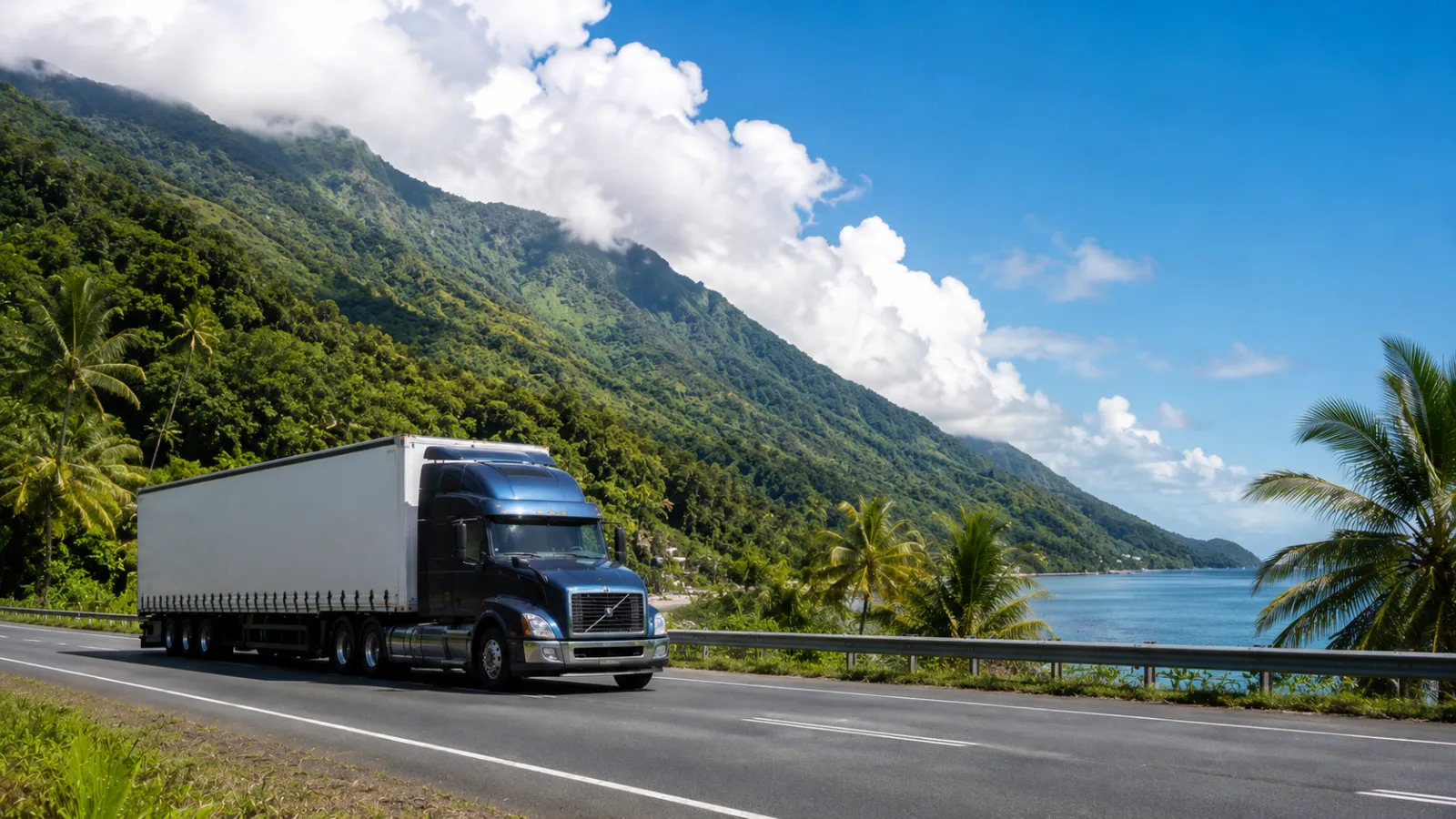 Semi-trailer on a coastal highway between rainforest ranges and reef water near Cairns