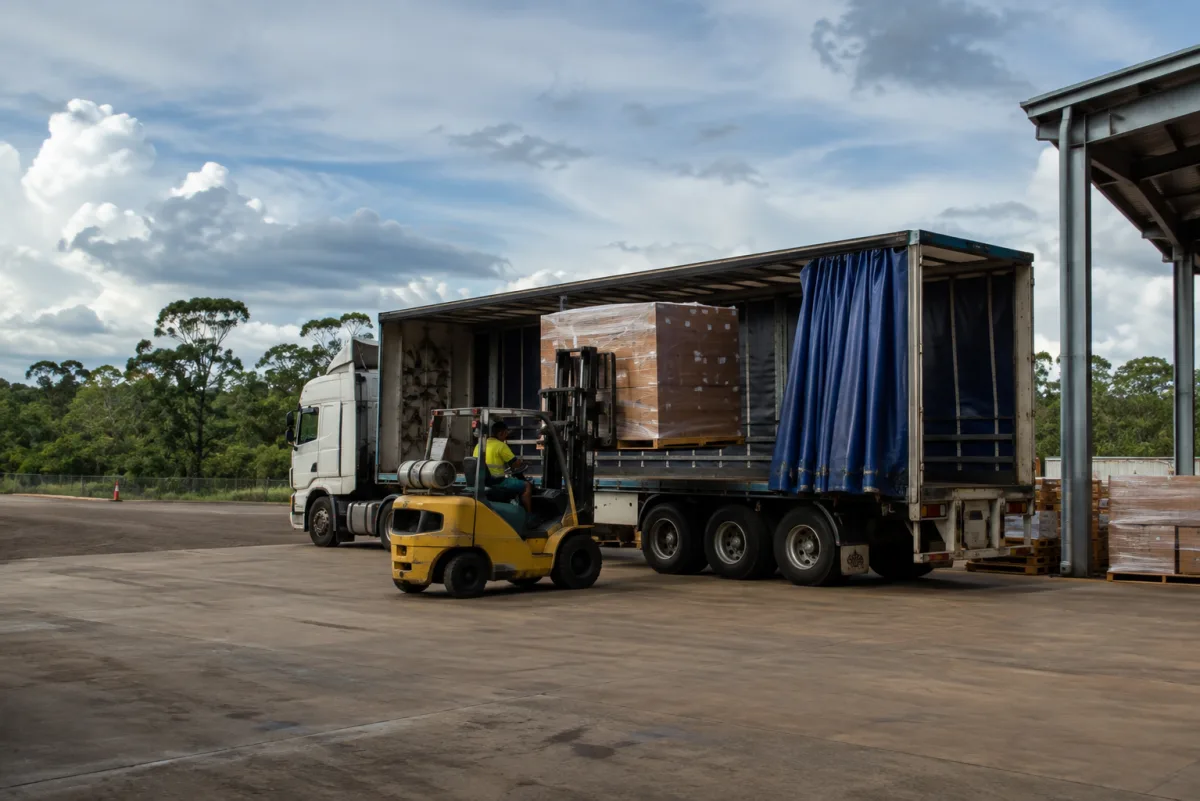 Forklift loading a trailer at a Winnellie depot for the run south