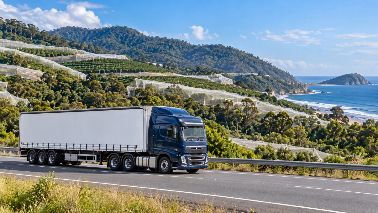 Semi-trailer on the highway past hillsides covered in white crop netting near Coffs Harbour