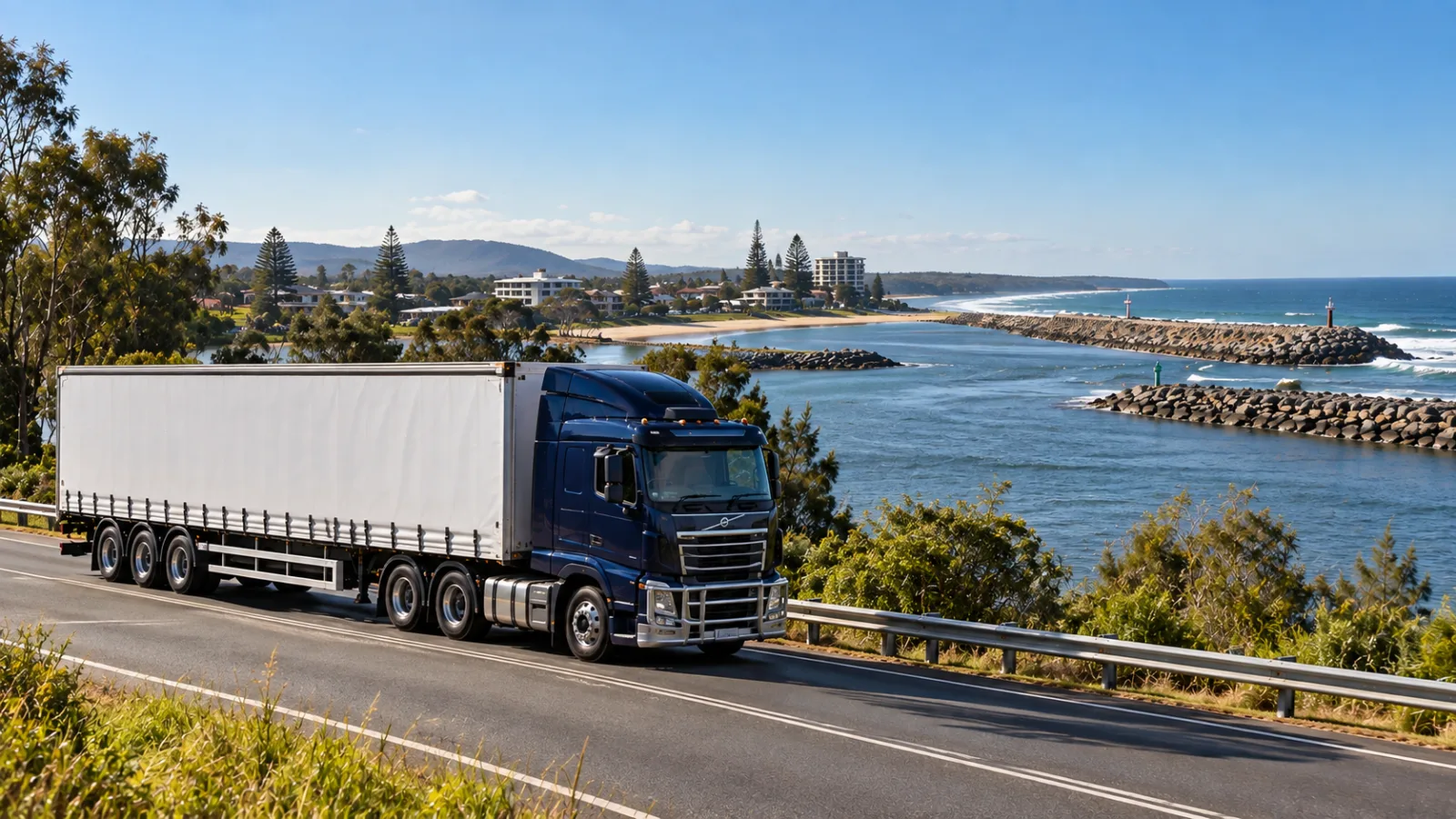 Semi-trailer beside the Hastings River mouth and breakwater at Port Macquarie