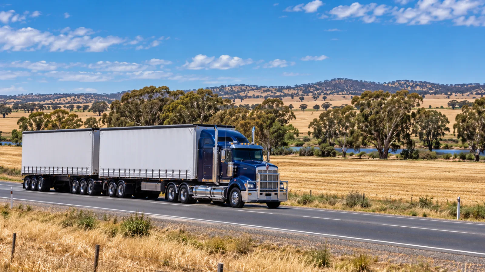 B-double on the Sturt Highway through Riverina cropping country near Wagga